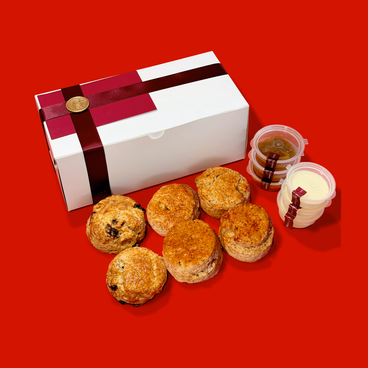 RAH Kitchen gift hamper with scones, jam, clotted cream, and a ribboned gift box